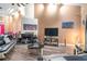 Living room with soaring ceilings, wood-look floors, and wall-mounted TV at 2291 Wilkins Ct, Decatur, GA 30035