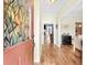 Elegant entryway with stained glass door, hardwood floors, and view into living room at 30 Bent Creek Way, Covington, GA 30014