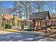 Community pool area with clubhouse, trees, and ample parking at 1108 Sandy Lane Dr # 1108, Alpharetta, GA 30022