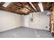 Unfinished basement area with concrete floor, exposed ceiling, and white brick walls at 1767 Big Horn Se Ct, Conyers, GA 30013