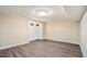 Finished basement with wood-look flooring and double doors at 1767 Big Horn Se Ct, Conyers, GA 30013