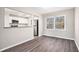 Dining area with wood-look flooring and view into the kitchen at 1767 Big Horn Se Ct, Conyers, GA 30013