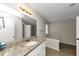 Bathroom with granite countertop and bathtub at 1299 Paddocks Way, Powder Springs, GA 30127