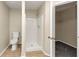 Simple bathroom with toilet and shower stall at 1299 Paddocks Way, Powder Springs, GA 30127