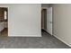 Bedroom with grey carpet and access to bathroom at 1299 Paddocks Way, Powder Springs, GA 30127
