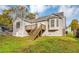 House exterior showcasing a deck and stairs leading to the backyard at 1299 Paddocks Way, Powder Springs, GA 30127