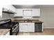 Kitchen with granite countertops and stainless steel appliances at 1299 Paddocks Way, Powder Springs, GA 30127