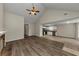 Open living room with kitchen view and hardwood floors at 1299 Paddocks Way, Powder Springs, GA 30127