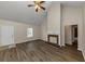 Living room with fireplace and vaulted ceiling at 1299 Paddocks Way, Powder Springs, GA 30127