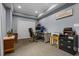 Basement home office with desk, chair, and built-in shelving at 1358 Fallsbrook Way, Acworth, GA 30101