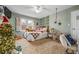 bedroom with a comfy bed, hanging chair, and a Christmas tree at 1358 Fallsbrook Way, Acworth, GA 30101