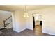 Bright dining room features hardwood floors and elegant chandelier at 3520 Bethesda Park Ct, Lawrenceville, GA 30044