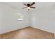 Well lit bedroom with ceiling fan and laminate flooring at 708 Martin Rd, Stone Mountain, GA 30088