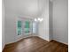 Sunlit dining room featuring hardwood floors and a bay window at 120 Black Rock Ct, Fayetteville, GA 30214