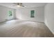 Large main bedroom with neutral carpeting and ample natural light at 120 Black Rock Ct, Fayetteville, GA 30214
