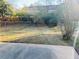 Fenced backyard with a patio and some trees at 2711 Greystone Ct, Austell, GA 30106