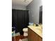 Bathroom with a shower, toilet, and sink at 2711 Greystone Ct, Austell, GA 30106