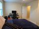 Bedroom with a bed, desk, computer, and chair at 2711 Greystone Ct, Austell, GA 30106