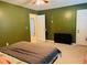 Bedroom with a bed, TV, and two doors at 2711 Greystone Ct, Austell, GA 30106