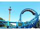 Blue rollercoaster and a swing ride at an amusement park at 2711 Greystone Ct, Austell, GA 30106