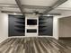 Finished basement with entertainment center, fireplace, and built-in shelves at 1880 Hays Farm Walk, Marietta, GA 30064