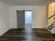 Basement space with barn door, laminate floors, and staircase at 1880 Hays Farm Walk, Marietta, GA 30064