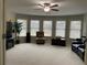 Bonus room with carpeted flooring, large windows, and ceiling fan at 1880 Hays Farm Walk, Marietta, GA 30064