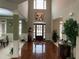Foyer with high ceilings, wood floors, and a view into the living room at 1880 Hays Farm Walk, Marietta, GA 30064