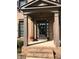 Close-up of front entry with a covered porch and brick steps at 1880 Hays Farm Walk, Marietta, GA 30064