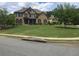 Large front yard with a two-story brick and shingle home at 1880 Hays Farm Walk, Marietta, GA 30064