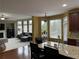 Open concept kitchen and living area with breakfast bar, modern appliances, and lots of windows at 1880 Hays Farm Walk, Marietta, GA 30064