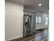 Kitchen with stainless steel refrigerator, grey cabinetry, and wood-look flooring at 1880 Hays Farm Walk, Marietta, GA 30064