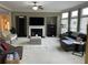Inviting living room featuring a fireplace, comfortable seating, and large windows at 1880 Hays Farm Walk, Marietta, GA 30064