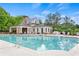 Community pool with clubhouse, fireplace, lounge area, and plenty of seating at 1880 Hays Farm Walk, Marietta, GA 30064