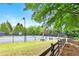Community tennis court surrounded by trees and a picnic area at 1880 Hays Farm Walk, Marietta, GA 30064