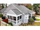 An aerial view of the back of the house with a screened porch, fenced backyard, and updated siding at 91 Morris Brown Sw Dr, Atlanta, GA 30314