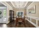 Formal dining room with hardwood floors, chandelier, and built-in cabinetry at 971 Hendon Rd, Woodstock, GA 30188