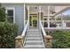 Stone steps leading to a screened porch at 971 Hendon Rd, Woodstock, GA 30188