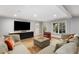 Comfortable basement Gathering room with sectional sofa and access to backyard at 195 Worth Dr, Atlanta, GA 30327