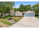 Charming single-story home with a two-car garage and landscaped front yard at 2921 Ward Lake Way, Ellenwood, GA 30294