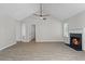 Living room with fireplace, vaulted ceilings, and wood-look floors at 2921 Ward Lake Way, Ellenwood, GA 30294