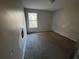 Simple bedroom with window and neutral walls at 5830 Burdett Ridge, Atlanta, GA 30349