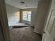 Spacious bedroom with large window and neutral walls at 5830 Burdett Ridge, Atlanta, GA 30349