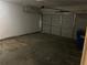 Empty attached garage with concrete floor at 5830 Burdett Ridge, Atlanta, GA 30349
