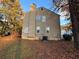 Tan house exterior, back deck, and partial view of yard at 5830 Burdett Ridge, Atlanta, GA 30349