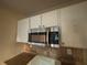 Kitchen with stainless steel microwave at 5830 Burdett Ridge, Atlanta, GA 30349