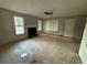 Living room with fireplace and large windows at 5830 Burdett Ridge, Atlanta, GA 30349