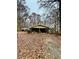 Ranch house with screened porch, attached garage, and large yard at 359 Cornish Mtn Rd, Oxford, GA 30054