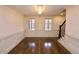 Dining room with elegant wainscoting, hardwood floors, and large windows at 1985 Mount Vernon Pl, Atlanta, GA 30338