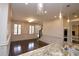 View of the dining area and staircase from the kitchen with granite countertops at 1985 Mount Vernon Pl, Atlanta, GA 30338